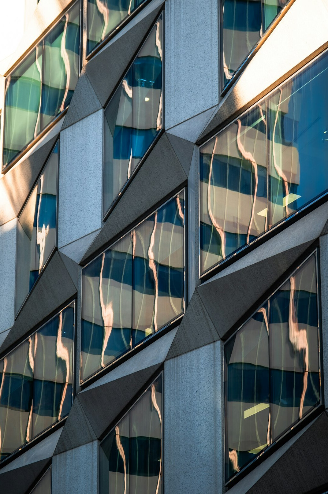 Modern Swiss media office building facade with glass windows